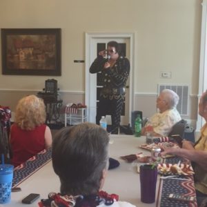 The Park Place Of Carrollton Residents Enjoy Watching The Elvis Impersonator At Their Event.