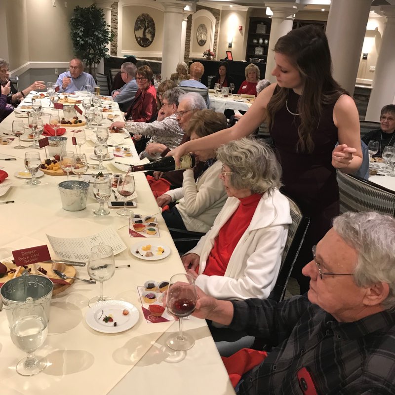 The Village of Bedford Walk hosts a Sip & Savor wine and food pairing event for residents.